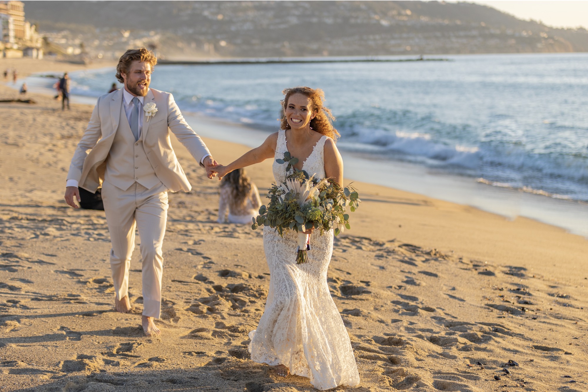Wedding Couple running on beaach