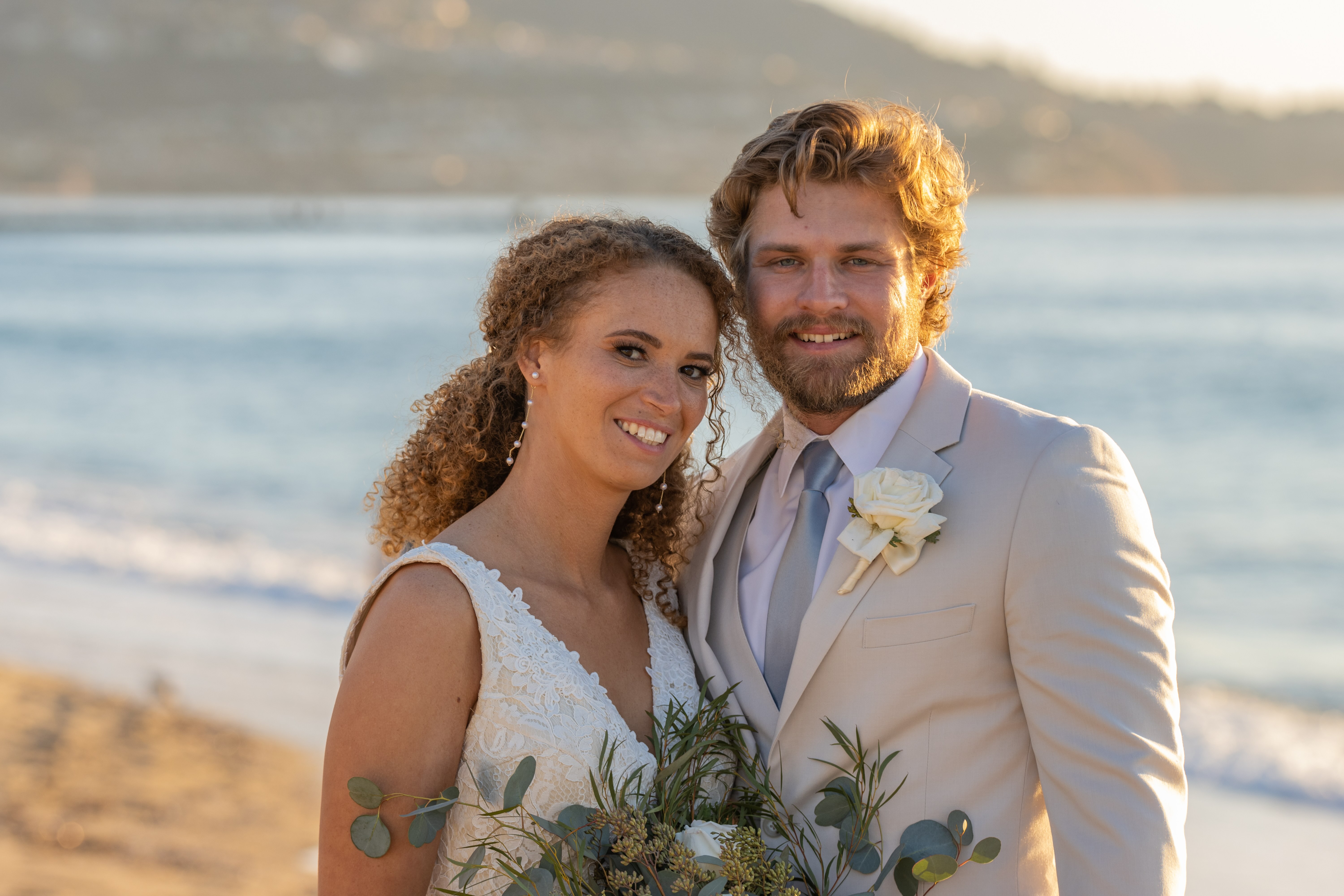 bride and groom on beach