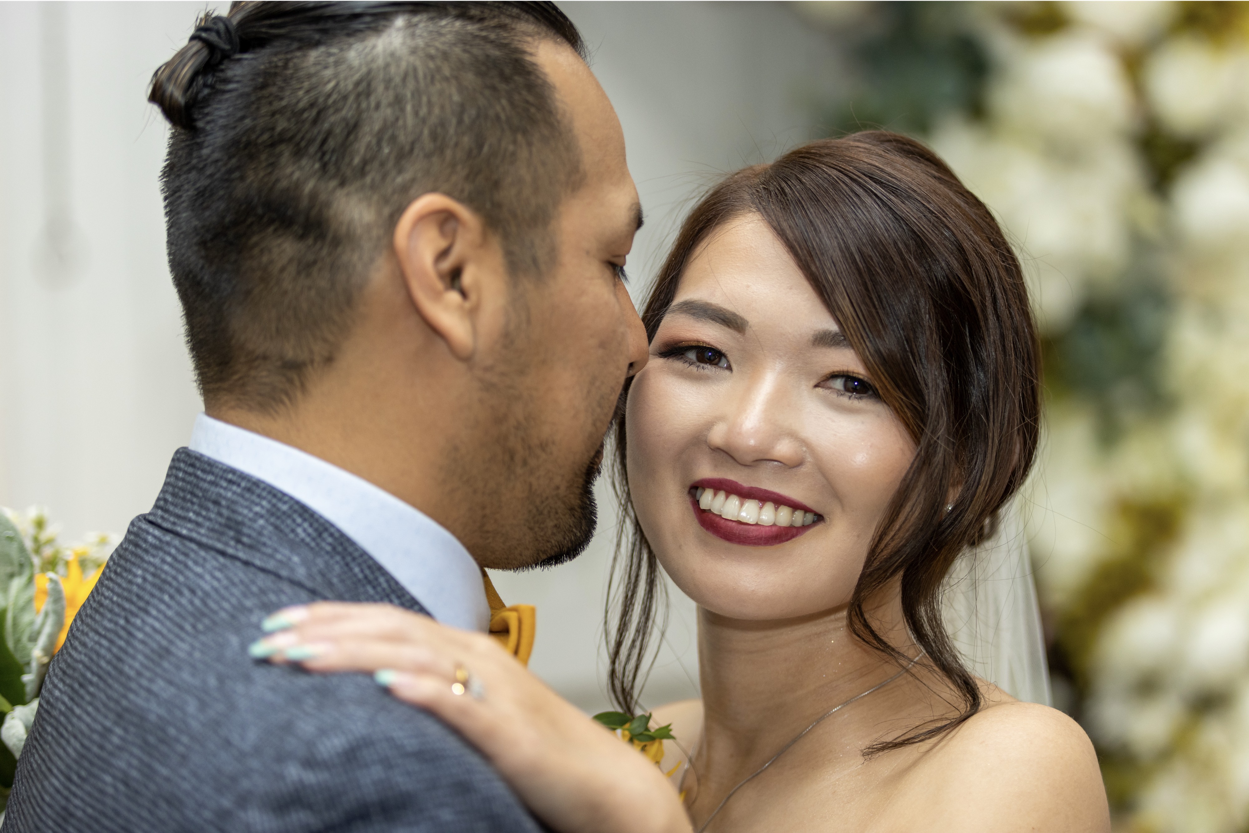 bride and groom smiling